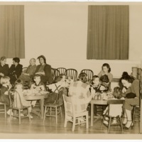 Students and adults eating a meal